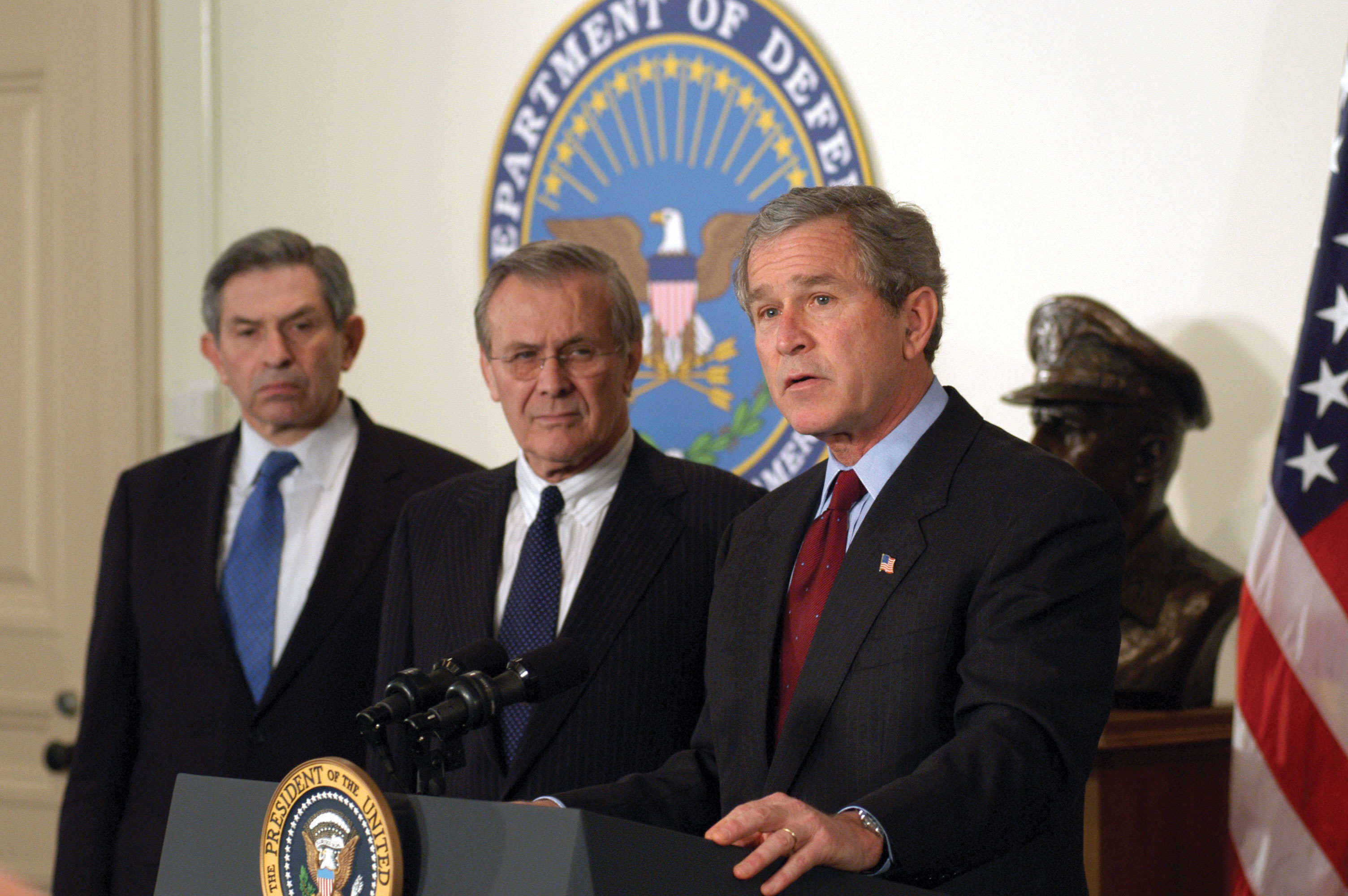 George Bush speaking at a press conference at the department of defense