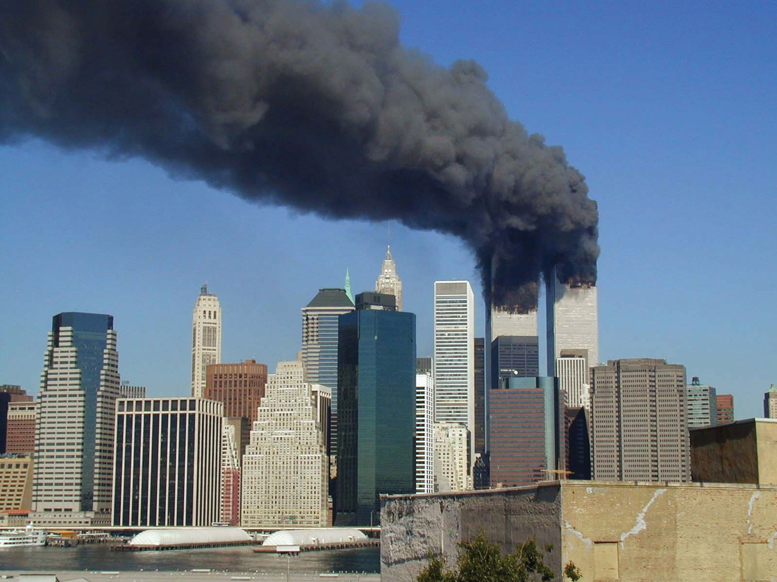 The twin towers still smoking, before they crumbled
