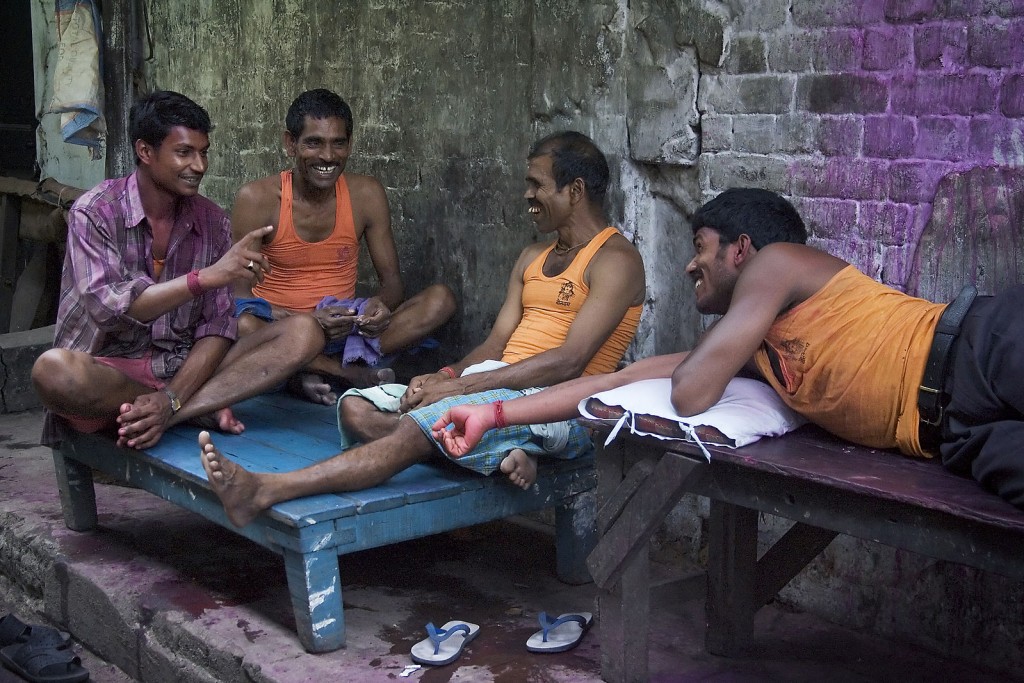 Four men conversing on the streets