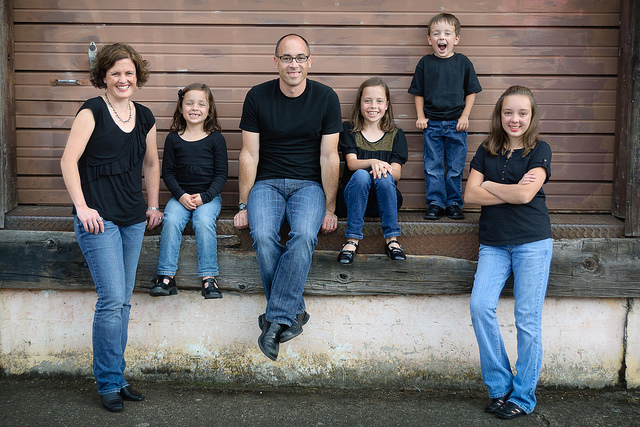 A white family smiling for family pictures