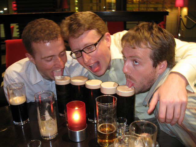 Three men tackling 5 glasses of beer