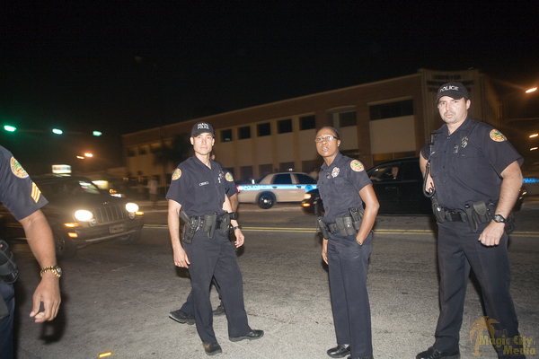Four police officers standing on the street