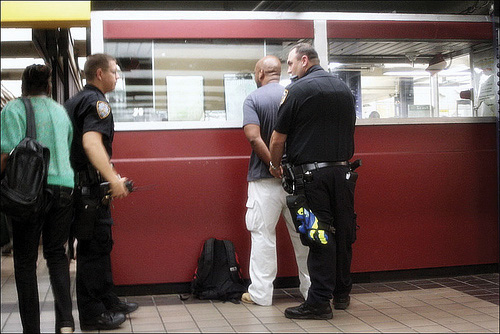 A man being handcuffed and arrested