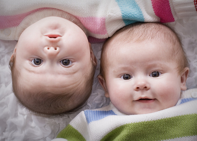 Twin babies side by side