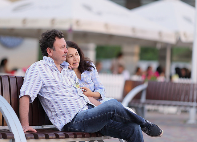 A couple sitting on a bench