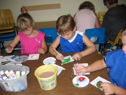 Children painting at daycare