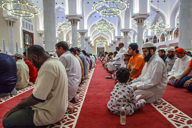 Many members of a mosque praying late into the night