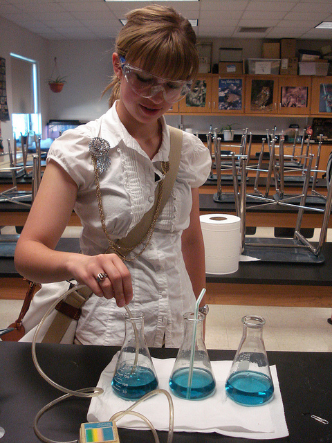 A student working on an experiment in science class