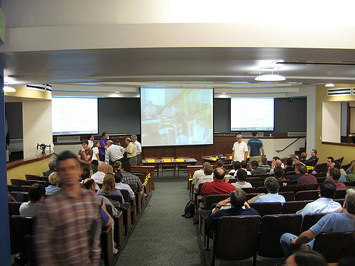 A classroom of students all watching a movie on the projector