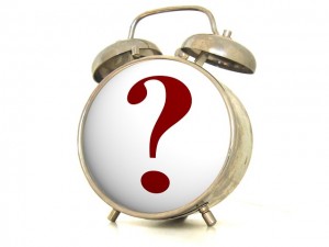 An alarm clock with a question mark on it