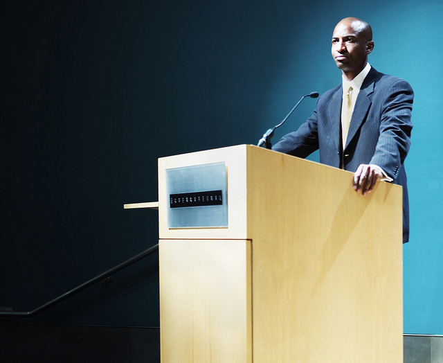 Man standing at a podium ready to speak