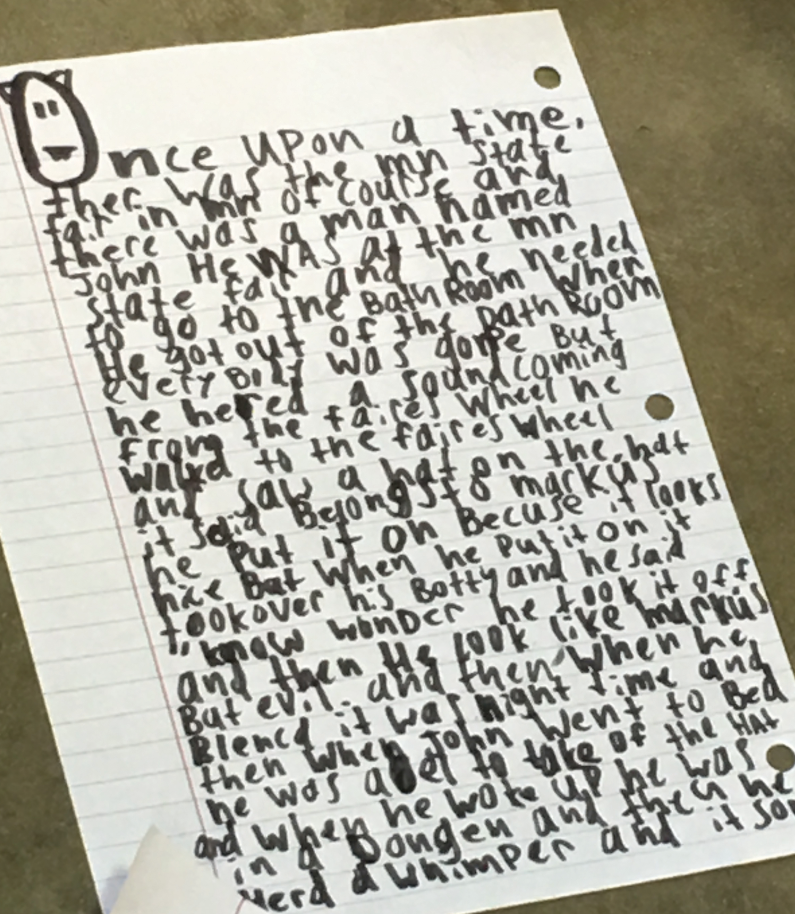 A handwritten story on a piece of notebook paper