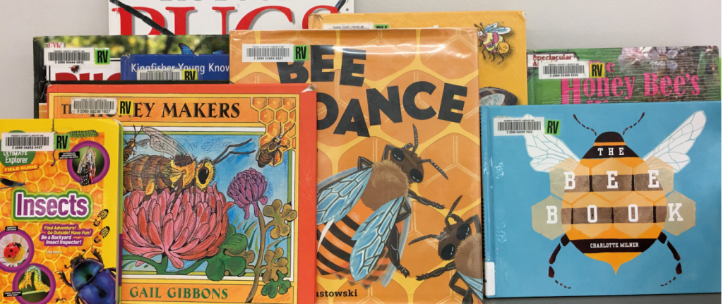 Eight book covers with bees on them