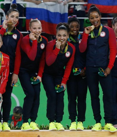 "Final Five Gymnastics Olympics Team Final Medal Ceremony" by Agência Brasil Fotografias is licensed under CC BY 2.0 / A derivative from the original work