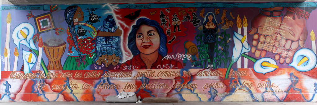 La Ofrenda Dolores Huerta Mural by Yreina Cervántez’ Los Angeles, Toluca at the First Avenue Bridge. The daughter of a migrant worker, Dolores Huerta was the first female Mexican American union leader. The text is mostly from poet, Gloria Alvarez, including the poem on the hands: "Mujer Heróicas mujeres de piedra que se alzan soberanas por toda la América entera, laboriosas, sonrientes generosas, forjadoras de futuro cada día construyendo una manana diferente en la calle, en escuela, en el camp, en la ciudad hijas todos del maiz constructoras de surcos en la angustia trasformadoras del sufrimiento en esperanzas y en suenos liberterios, que nos dan la vida...eterna..."