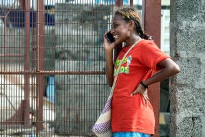 Young woman talking on a cell phone.