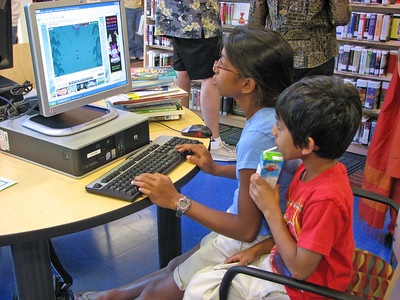 Children watching a video on a computer screen