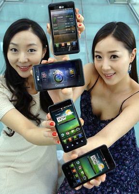 Women holding cell phones up to the camera.