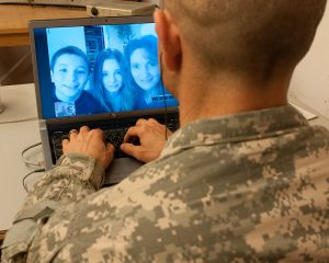Solider video chatting with his family.